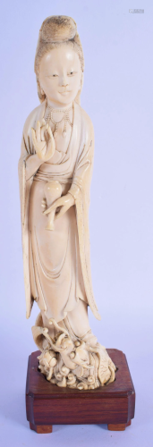 AN 18TH/19TH CENTURY CHINESE CARVED IVORY FIGURE OF…
