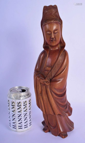 A 19TH CENTURY CHINESE CARVED HARDWOOD FIGURE OF AN