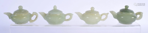 FOUR CHINESE JADE TEAPOTS 20th Century. 7 cm wide. (4)
