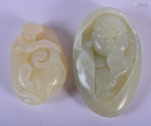 TWO CHINESE CARVED JADE PEBBLE PENDANTS 20th Century.