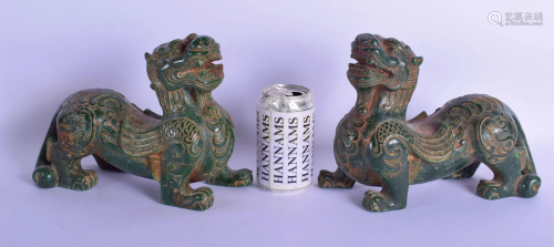 A LARGE PAIR OF CHINESE JADE TYPE FIGURES OF STYLISED