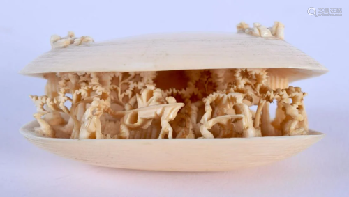 A 19TH CENTURY CHINESE CARVED IVORY CLAM SHELL