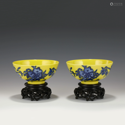 PAIR YONGZHENG YELLOW GLAZED BOWLS ON STANDS