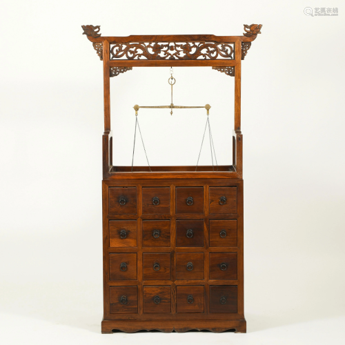 AN ANTIQUE HUANGHUALI MEDICINE CABINET