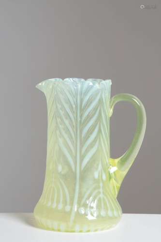 Decorated jug in vaseline glass. Early 20th c