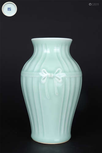 A CELADON-GLAZE MELON-SHAPED WRAPPED BUNDLE VASE