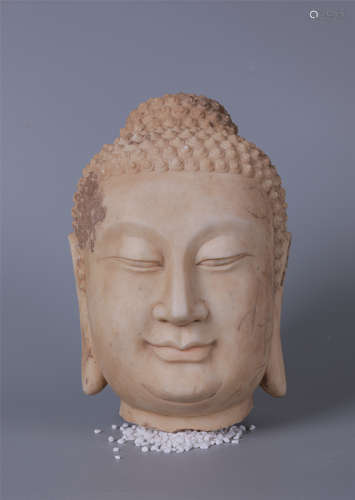 A CARVED MARBLE STONE BUDDHA HEAD