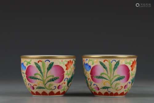 A PAIR OF CLOISONNE ENAMEL PEACH AND FLOWER CUPS