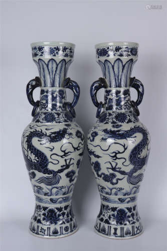 A PAIR OF BLUE AND WHITE DRAGON VASES