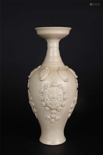 A DING WARE WHITE-GLAZE APPLIQUE-DECORATED DISH-TOP VASE