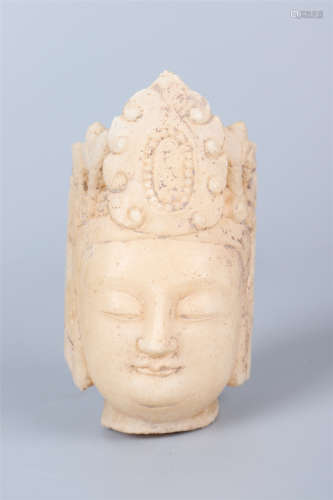 A CARVED MARBLE STONE BUDDHA HEAD