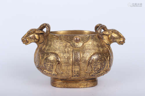 A GILT BRONZE DOUBLE RAM-EARED CENSOR