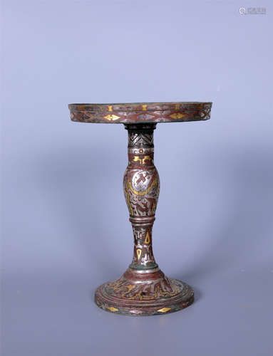 A PARCEL-GILT BRONZE CANDLESTICK