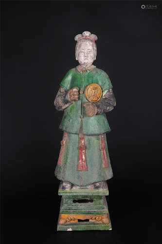 A SANCAI-GLAZE POTTERY FIGURE OF ATTENDANT