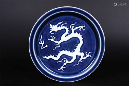 A BLUE AND WHITE REVERSE-DECORATED DRAGON DISH
