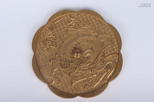 A GILT BRONZE DRAGON AND CLOUD LOBED MIRROR