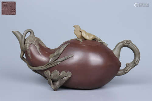 A PURPLE CLAY EGGPLANT AND BIRDS TEAPOT
