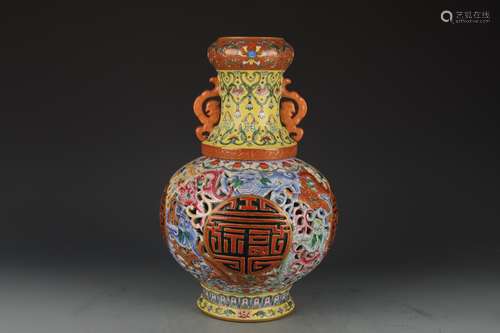 AN OPENWORK YELLOW-GROUND ENAMEL REVOLVING GLOBULAR VASE