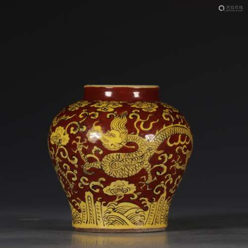 A RED-GROUND AND YELLOW-ENAMEL DRAGON AND WAVE JAR