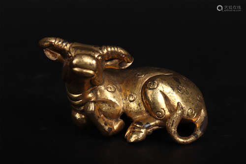 A GILT BRONZE BUFFALO ORNAMENT