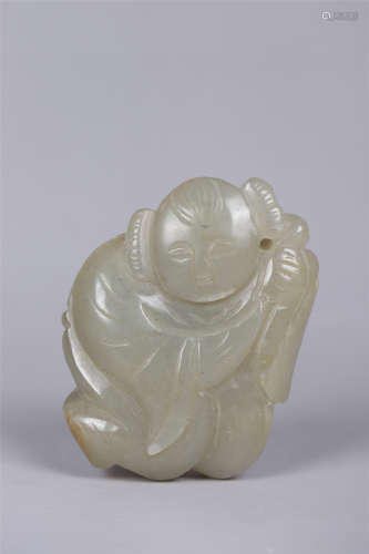 A JADE CARVING OF A FIGURE