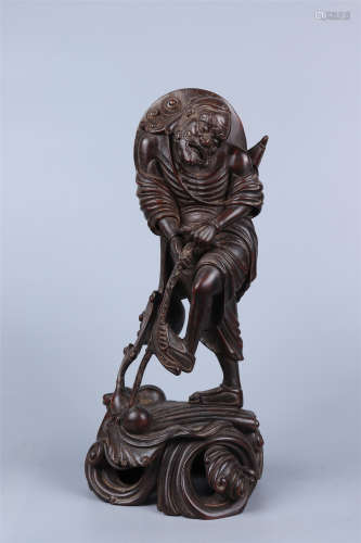 A CARVED EAGLEWOOD FIGURE STATUE