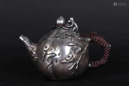 A SILVER MONKEY AND PEACH POT