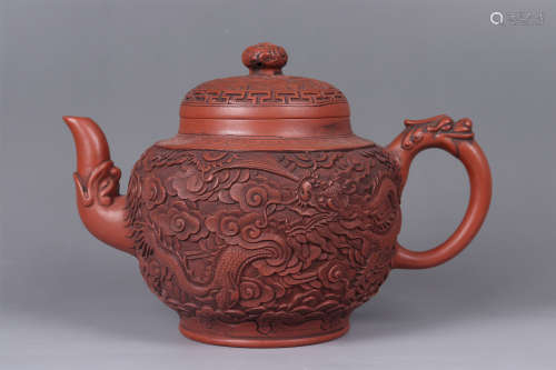 A CARVED DRAGON AND PHOENIX PURPLE CLAY POT