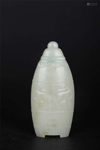 A CARVED JADE BEAST PATTERN VASE AND COVER
