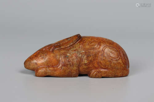 A ARCHAIC JADE CARVING OF A RABBIT