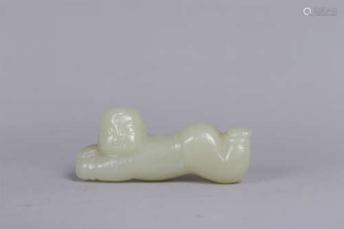 A JADE CARVING OF A CHILD