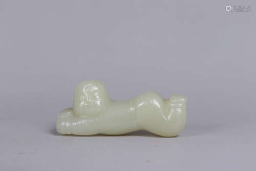 A JADE CARVING OF A CHILD