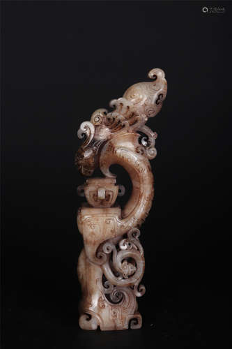 AN OPENWORK BROWNISH JADE ARCHAIC ORNAMENT