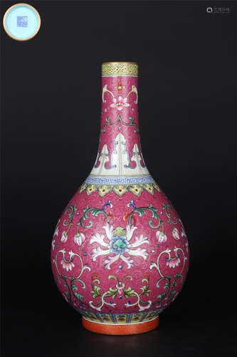 A ROUGE-RED-GROUND FAMILLE ROSE INTERLOCKING LOTUS BOTTLE VA...