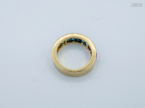 A rainbow half eternity ring with coloured stones