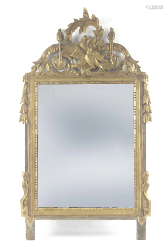 A late 18th century Louis XVI mirror in carved and gilt