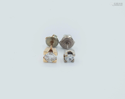 Two diamond stud earrings