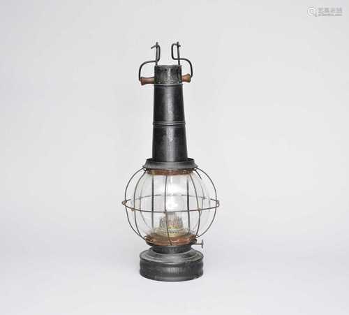 A painted cast metal oil lantern