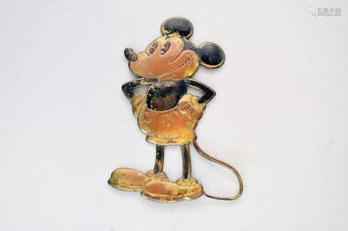 A 1930s stamped metal figure of Mickey Mouse (car radiator m...