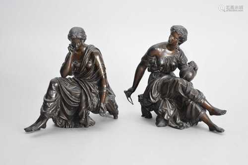 A pair of patinated spelter figures of muses