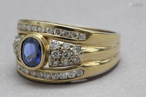 A sapphire and diamonds ring with an 18k. yellow gold