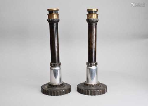 Of industrial interest: a pair of steel and brass candlestic...