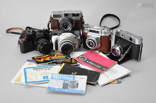 A Nikon 35mm SLR and various other roll film cameras