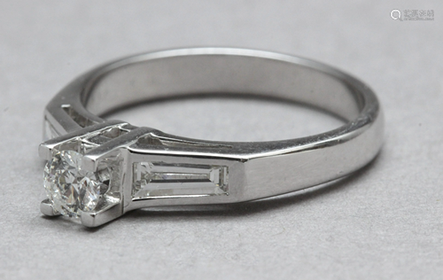 A three stone diamond engagement ring