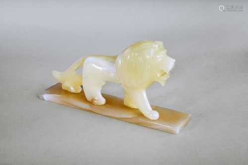 An art deco style onyx figure of a lion