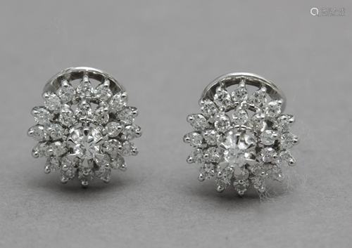 A pair of diamond cluster earrings