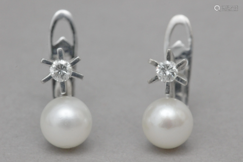 A pair of 'toi et moi' earrings
