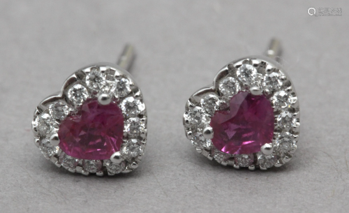 A diamond and rubies heart shaped stud earrings