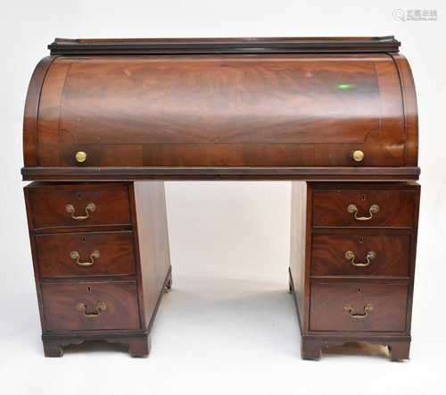 A William IV mahogany cylinder-topped bureau