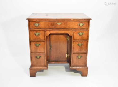 A George II style walnut kneehole desk